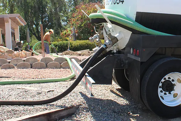Technician providing septic tank service for a Menifee, CA homeowner